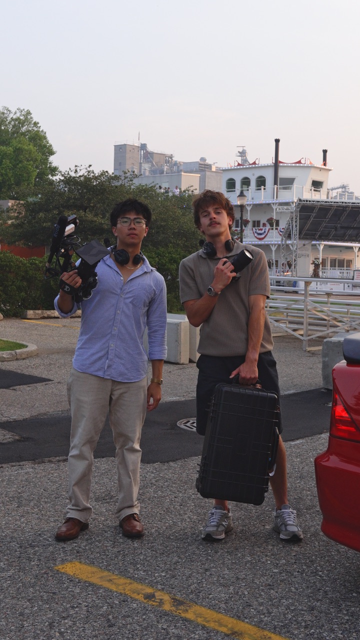 Jake and Ethan holding cameras