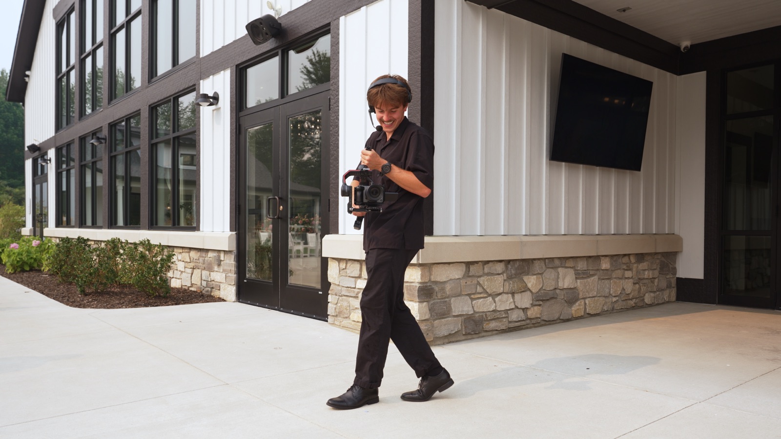 Jake walking with a camera