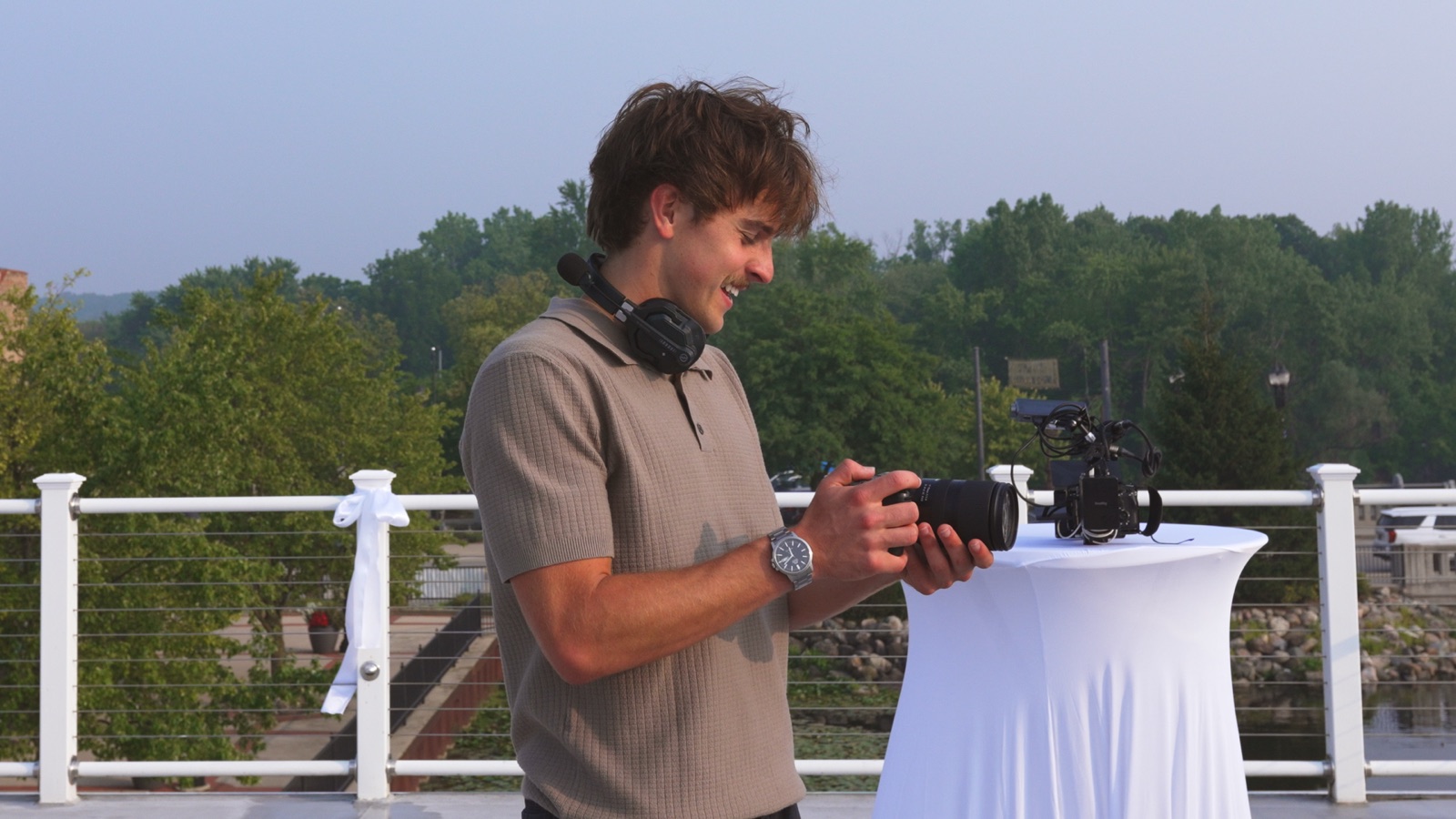 Jake at a camera on a rooftop